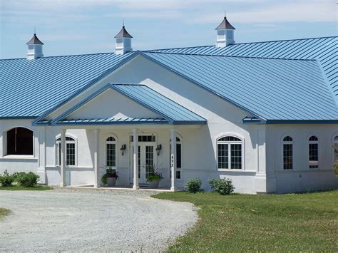 sand colored house blue metal roof|blue metal roof exterior home.